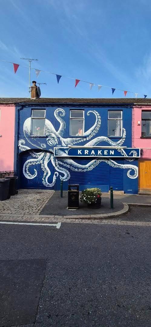 Kraken shopfront on High Street, Killyleagh — a blue building painted with a giant white octopus